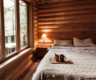 Rustic interior of log cabin bedroom